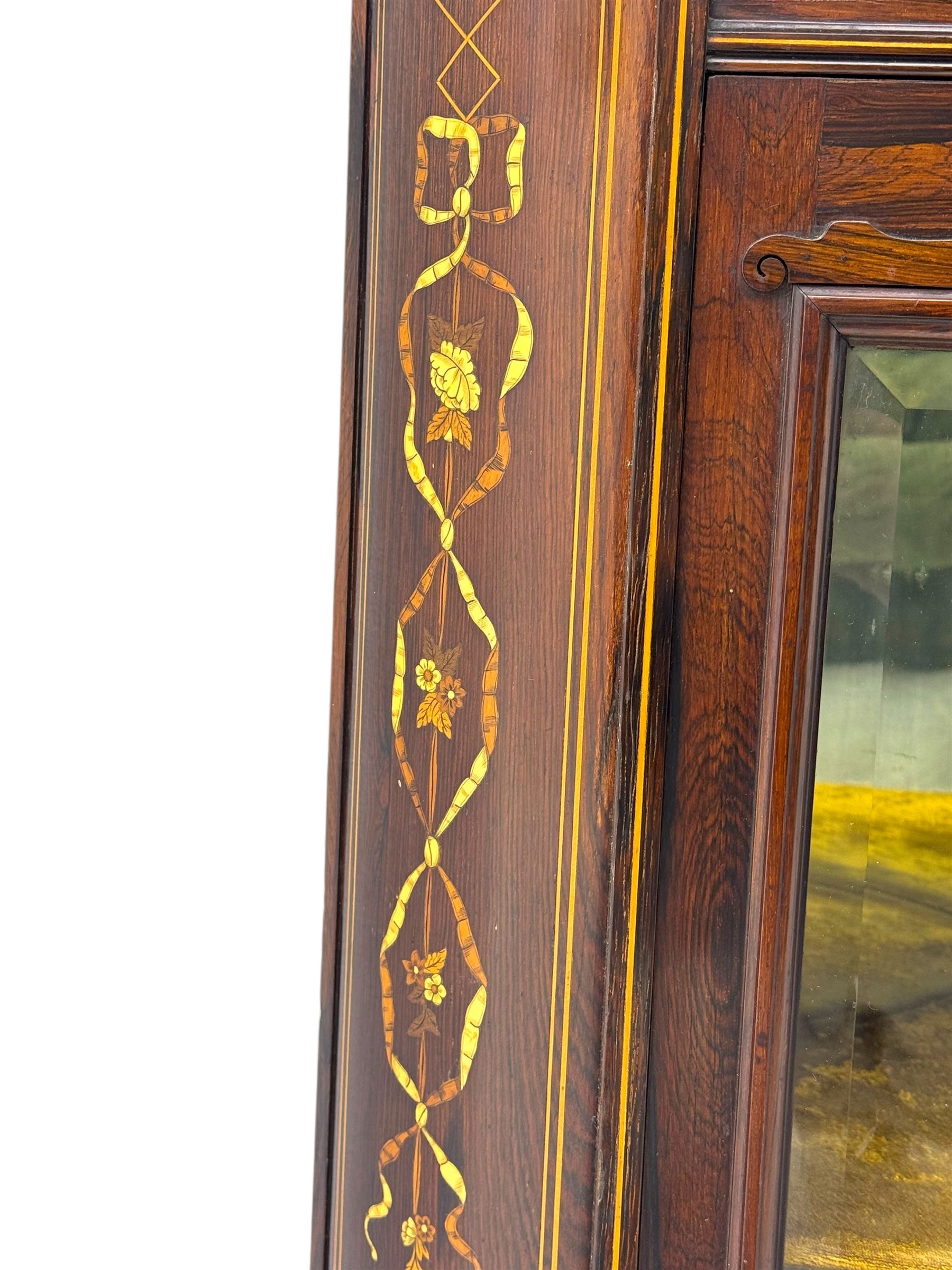 Late 19th century inlaid rosewood free standing corner display cabinet, the upper section featuring a mirrored panel above an inlaid cupboard with a felt-lined interior, complemented by a recessed open compartment with a mirrored back, the base with a glazed door enclosing two felt-lined shelves, on turned supports