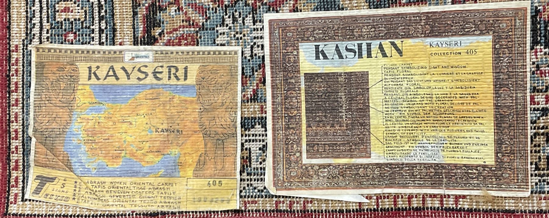 Persian design rug, rectangular crimson ground field with medallion, surrounded by trailing foliate branches, within wide border bands decorated with stylised floral motifs 