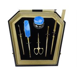 Art Deco thirteen piece silver mounted blue guilloche enamel dressing table set, comprising two hair brushes, two clothes brushes, hand mirror, two cut glass jars, buffer and a cut glass scent bottle, hallmarked J W Tiptaft & Son Ltd, Birmingham 1930 and 1932, and a silver handled manicure set, hallmarked Daniel Manufacturing Company, Birmingham 1930, with a pair of base metal scissors, each contained within three original fitted cases with black and cream silk and velvet lined interiors, one with removable mirror