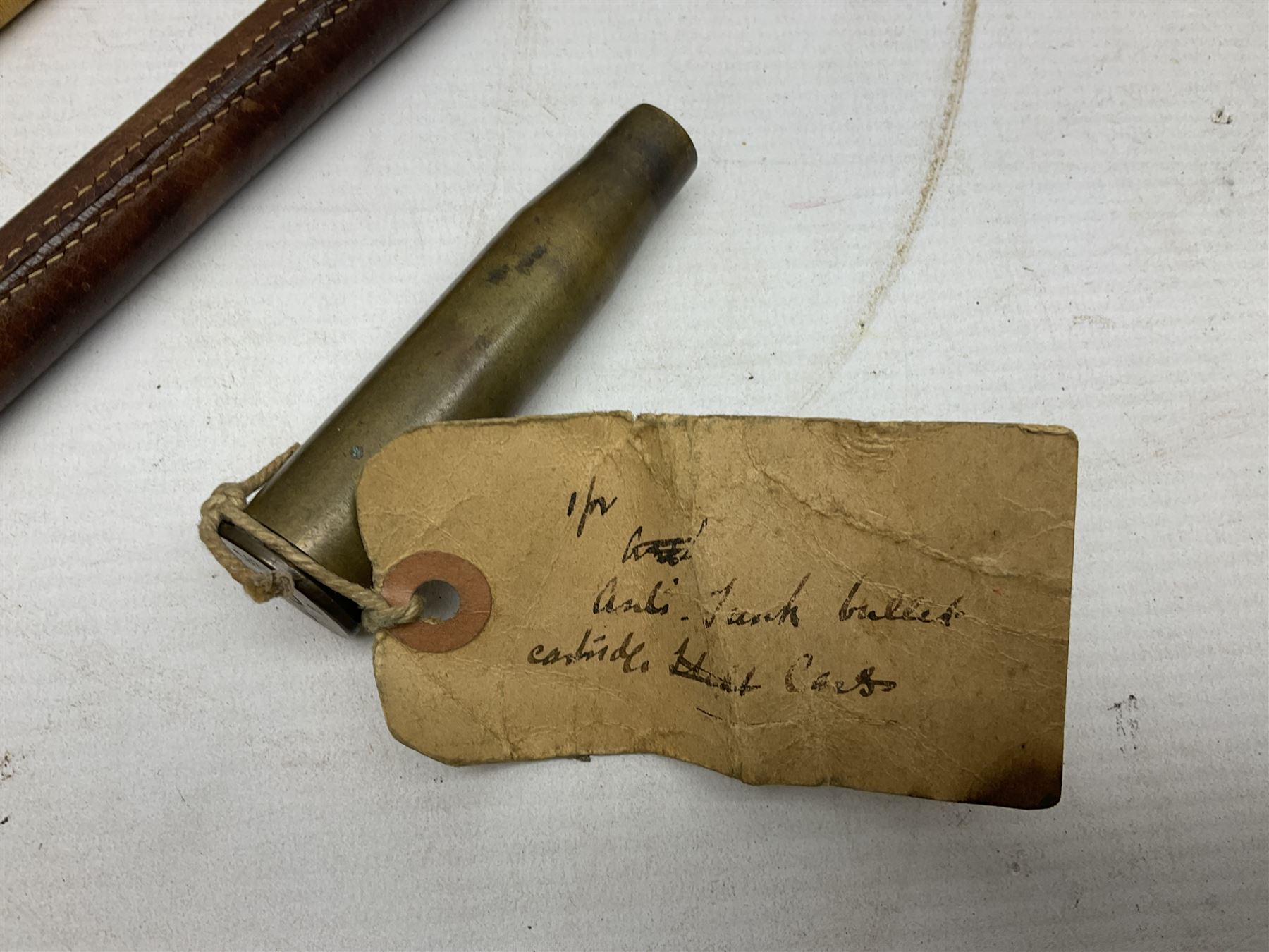 WW2 copper and brass bugle inscribed George Potter & Co, Aldershot 1939 L28cm; two cane and one leather covered swagger sticks; and three small pairs of plain brass shell cases (10)