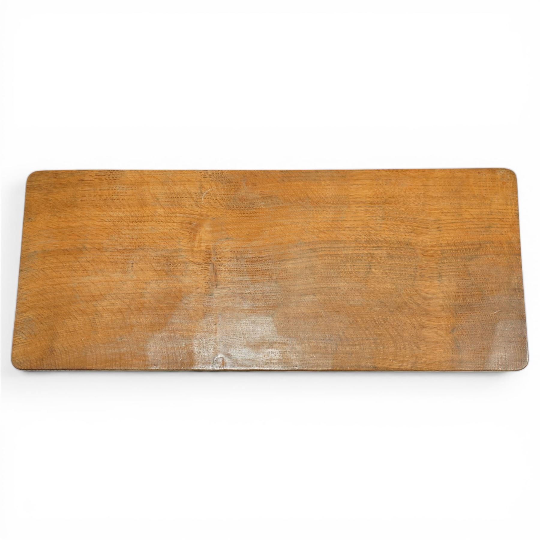 Mouseman - oak rectangular adzed coffee table, octagonal supports united by stretcher terminating in sled feet, with carved mouse signature, by the workshop of Robert Thompson of Kilburn 