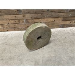 19th century circular stone mill wheel,