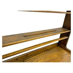 19th century and later oak dresser, moulding cornice a pierced and shaped frieze, over two open plate shelves above a base fitted with two drawers with brass swan neck handles, over panelled twin cupboard with single shelf, cantered corners on bracket feet