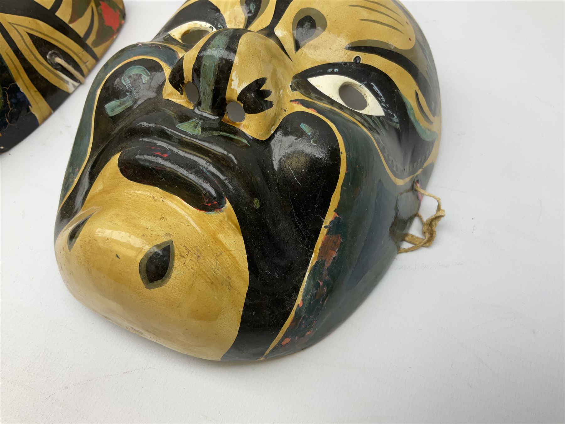 Five Japanese theatre / opera masks, the papier-mâché traditionally painted in the Noh Kabuki style, L18cm