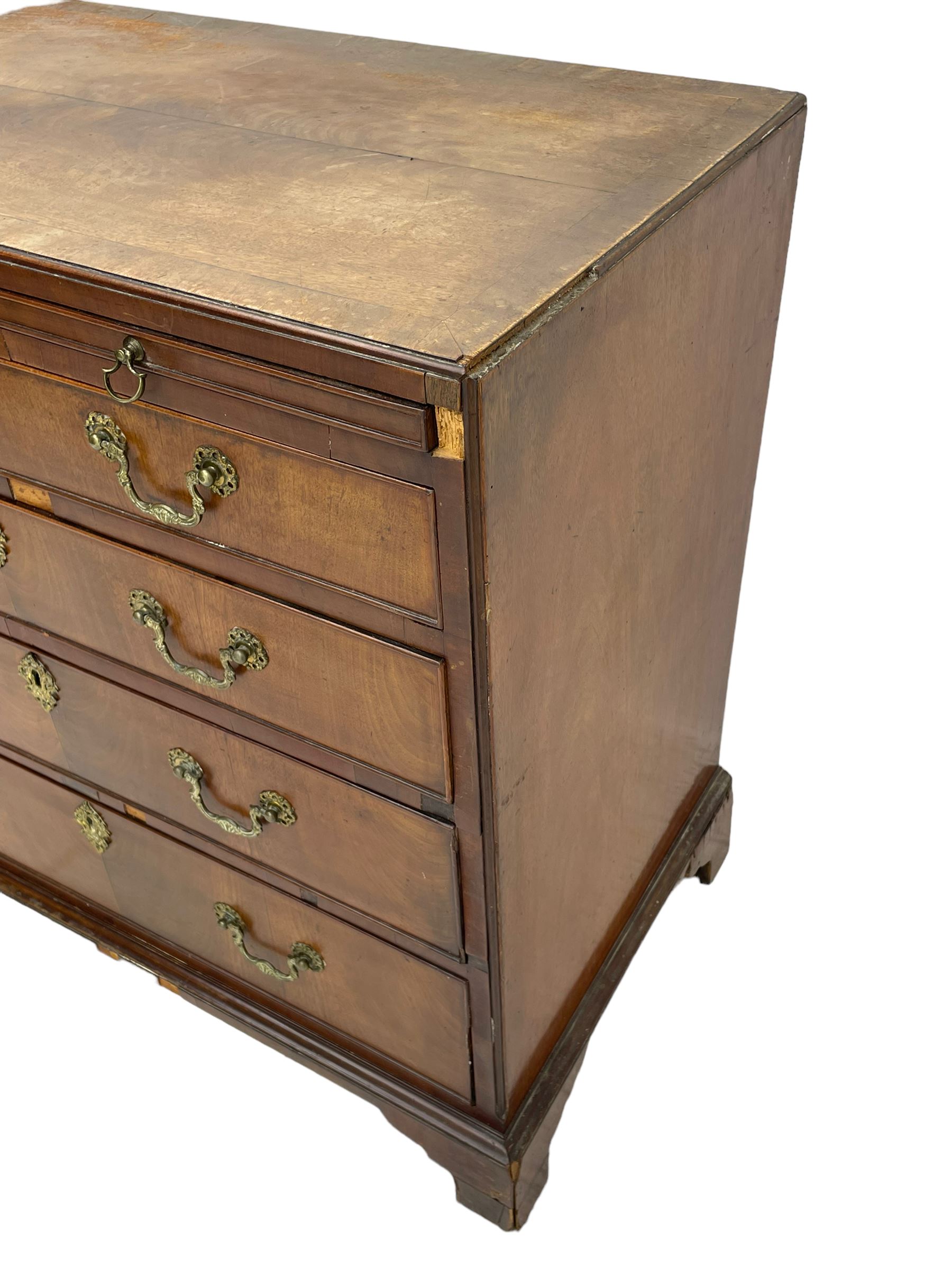 George III mahogany chest, banded caddy top with moulded edge, brushing slide over four graduating cock-beaded drawers, ornate cast gilt metal handle plates and escutcheons, swan neck handles cast with dolphins, shells and C-scrolls, lower moulding over bracket feet