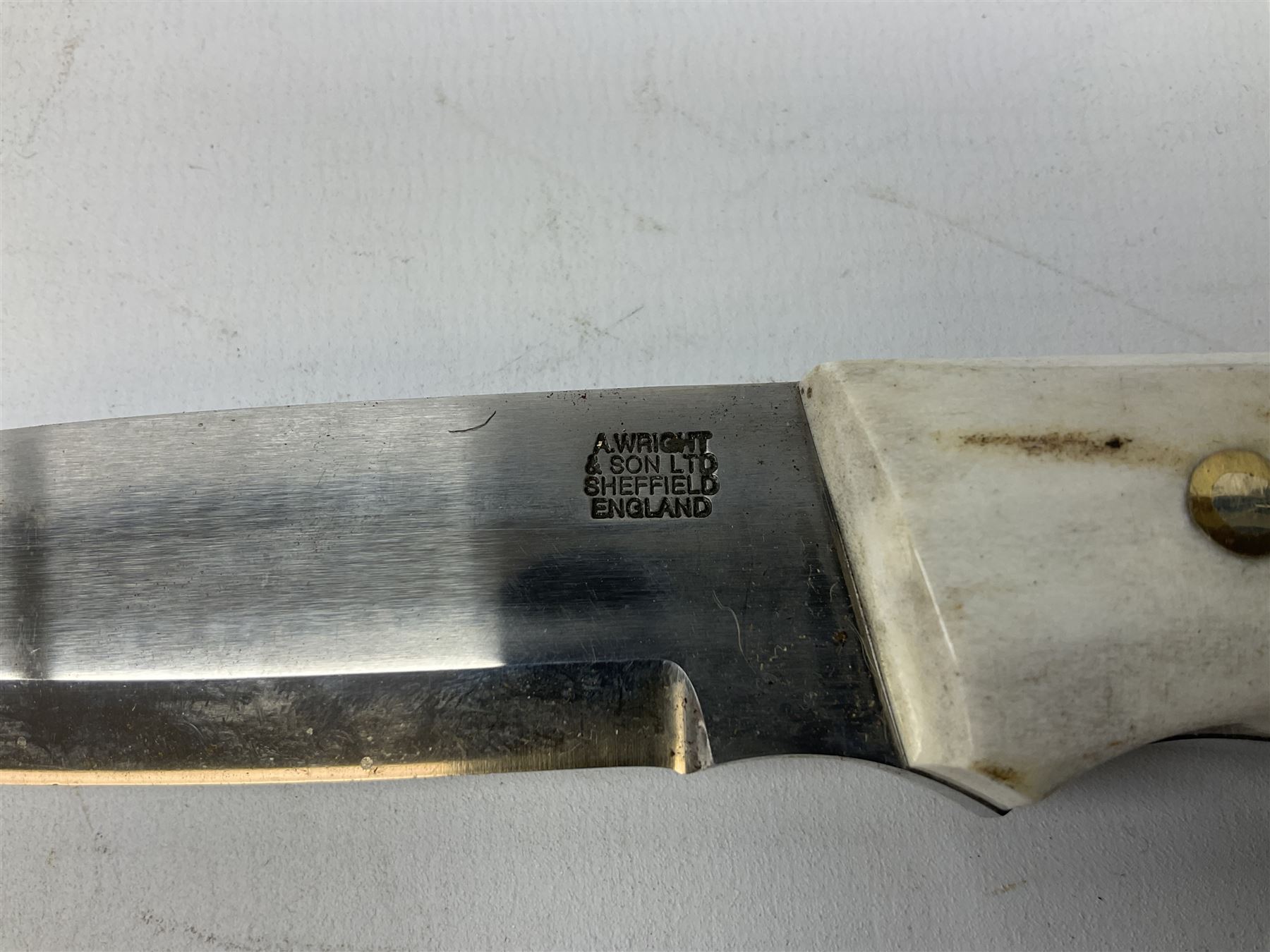 Three hunting knives, each blade marked A. Wright & Sons Sheffield, one with leather handle, one with horn handle and one with antler handle; each with leather sheath (3)