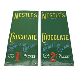 Two green enamel vending machine signs 'Nestle's Milk Chocolate the richest in cream'