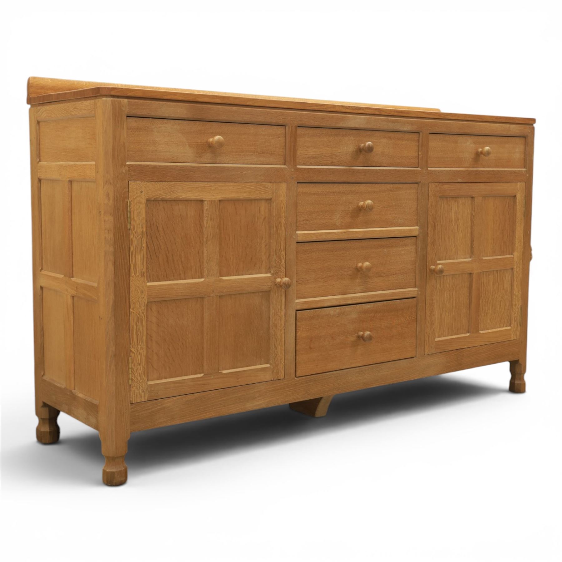 Mouseman - adzed oak dresser, fitted with six drawer and two cupboards, with carved mouse signature, by the workshop of Robert Thompson of Kilburn