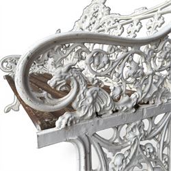 Coalbrookdale Gothic design cast iron and slatted teak garden bench, the ornate pierced back and sides of arched design, with central cartouche shield surrounded by stylised crosses and trefoils with interspersed flowerheads, the scrolled arm terminals with stylised griffon motifs and trailing fruiting vines 