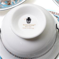 Wedgwood turquoise Florentine part service, comprising large covered tureen and stand, coffee pot, teapot, two covered sucriers, milk jug, two sauce boats and stands, seven soup plates, three bowls, jug, eighteen soup bowls and fifteen stands, two ashtrays, thirteen further saucers, twelve teacups and eleven saucers, and twenty-one further plates of varying sizes