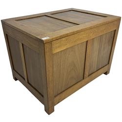 20th century panelled oak blanket chest, rectangular hinged top, raised on square supports