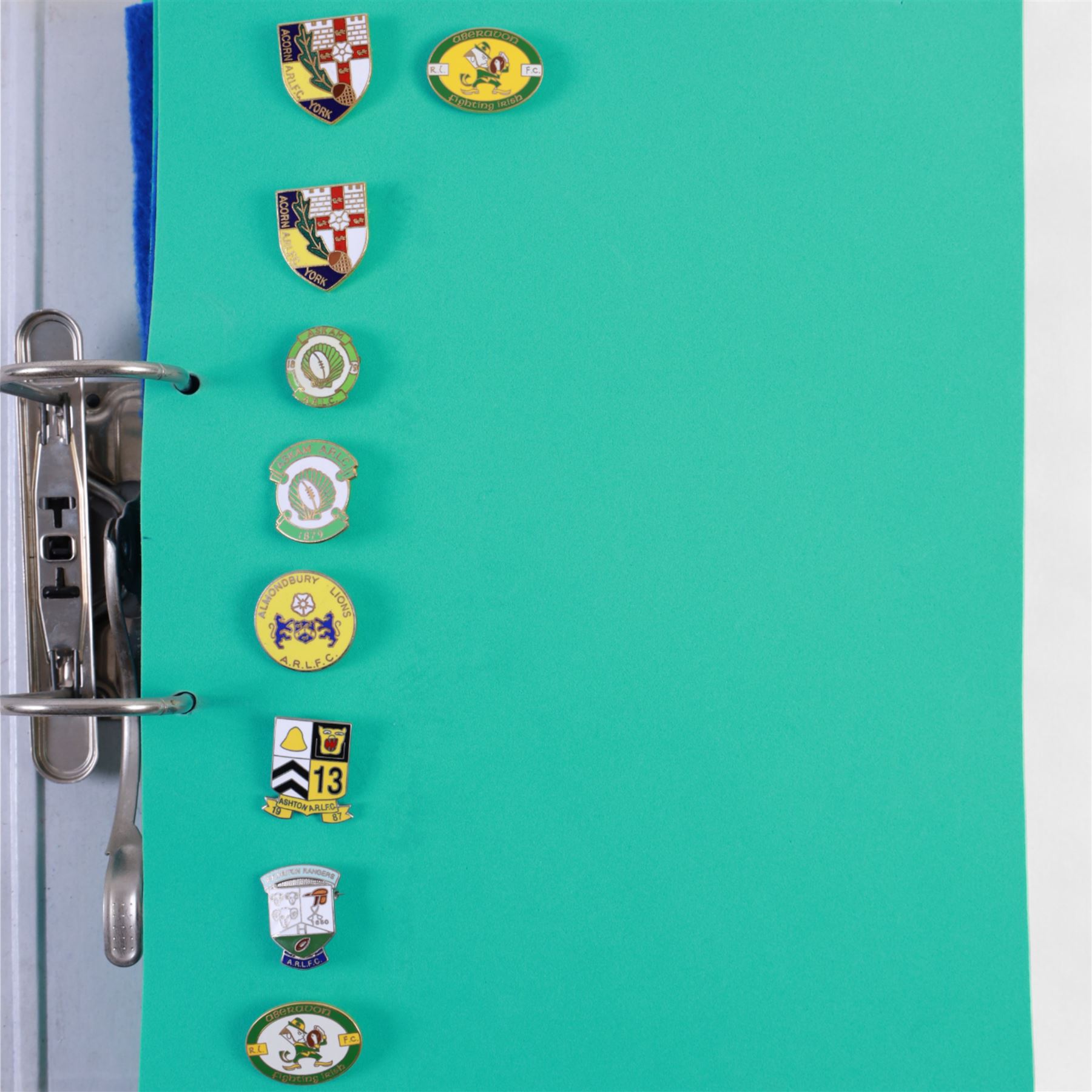 Amateur rugby league enamel badge collection, teams including Birmingham Bulldogs, Bridlington, Dudley Hill, Duke of York, Edinburgh Eagles, Guiseley, Rangers, Huntingdon, Keighley Town, Leigh Miners, Pilkington Recs, St Josephs, Thornhill Trojans, West London Sharks etc, all displayed in three folders and six amateur league badges from Leeds & District, Hull & District, York & District, Warrington, Lancashire County and Yorks County in box display, (approximately 270)
