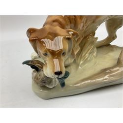 Royal Dux porcelain hunting dog with a bird, printed mark beneath, L36cm