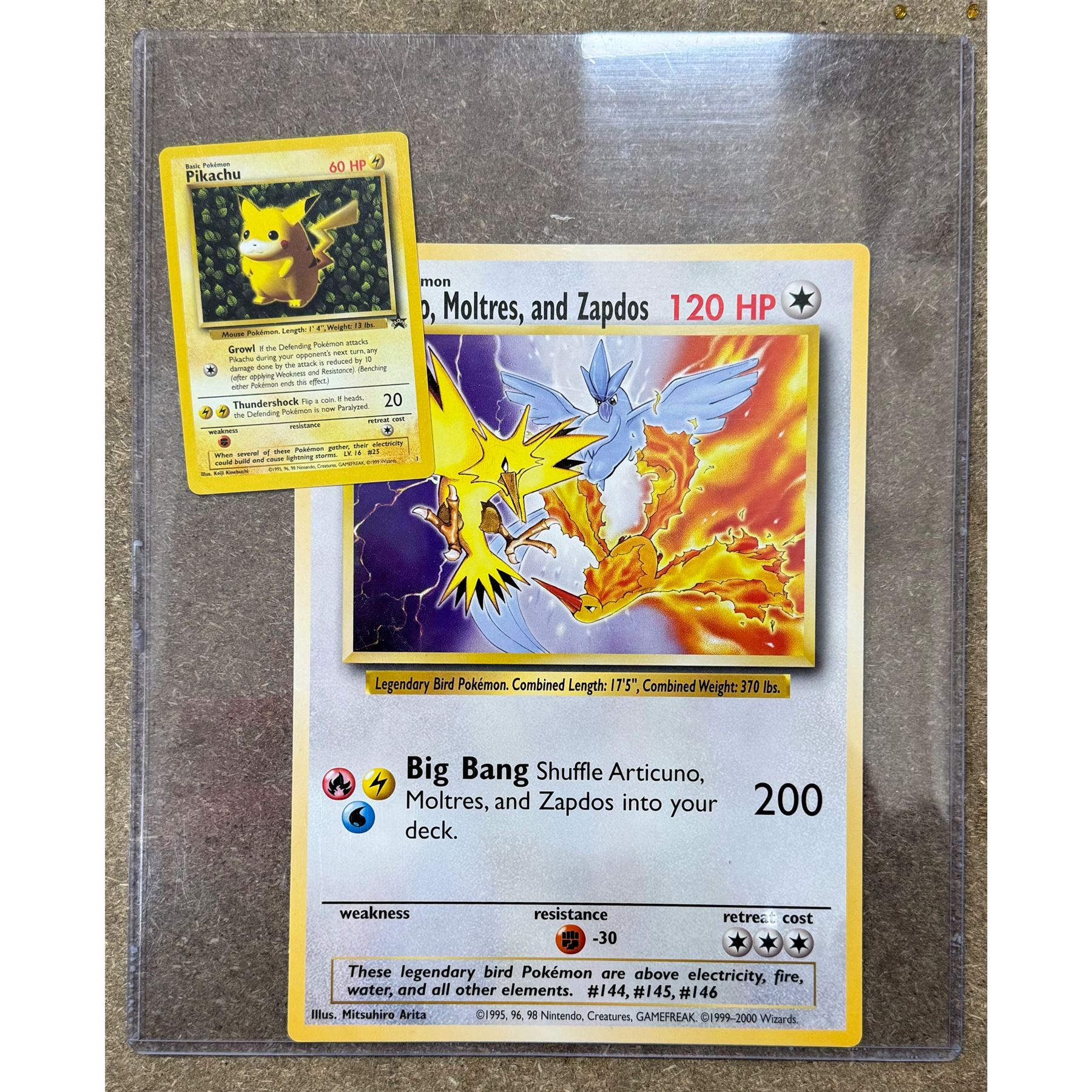 Collection of approximately 400 Pokemon trading cards, mostly 1999 Wizards Pokemon cards to include 1st Edition Dark Gyarados holo 8/82, Dark Charizard 4/82 holo and 21/82 non holo, Dark Blastoise 3/82 holo and 20/82 non holo, Dark Raichu holo 83/82, Dark Dragonite 22/82, eleven first edition cards, Japanese cards, Trainer cards, etc, together with an album of Pokemon the First Movie cards, a voice actor signed copy of Pokemon: The First Movie Animation Comics Mewtwo Strikes Back #1, 5305/8000 with certificate of authenticity with comics 2, 3 and 4 