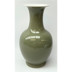 A celadon glaze vase, of baluster form with tall neck and flared rim, with foliate decoration, painted mark beneath, H31cm.