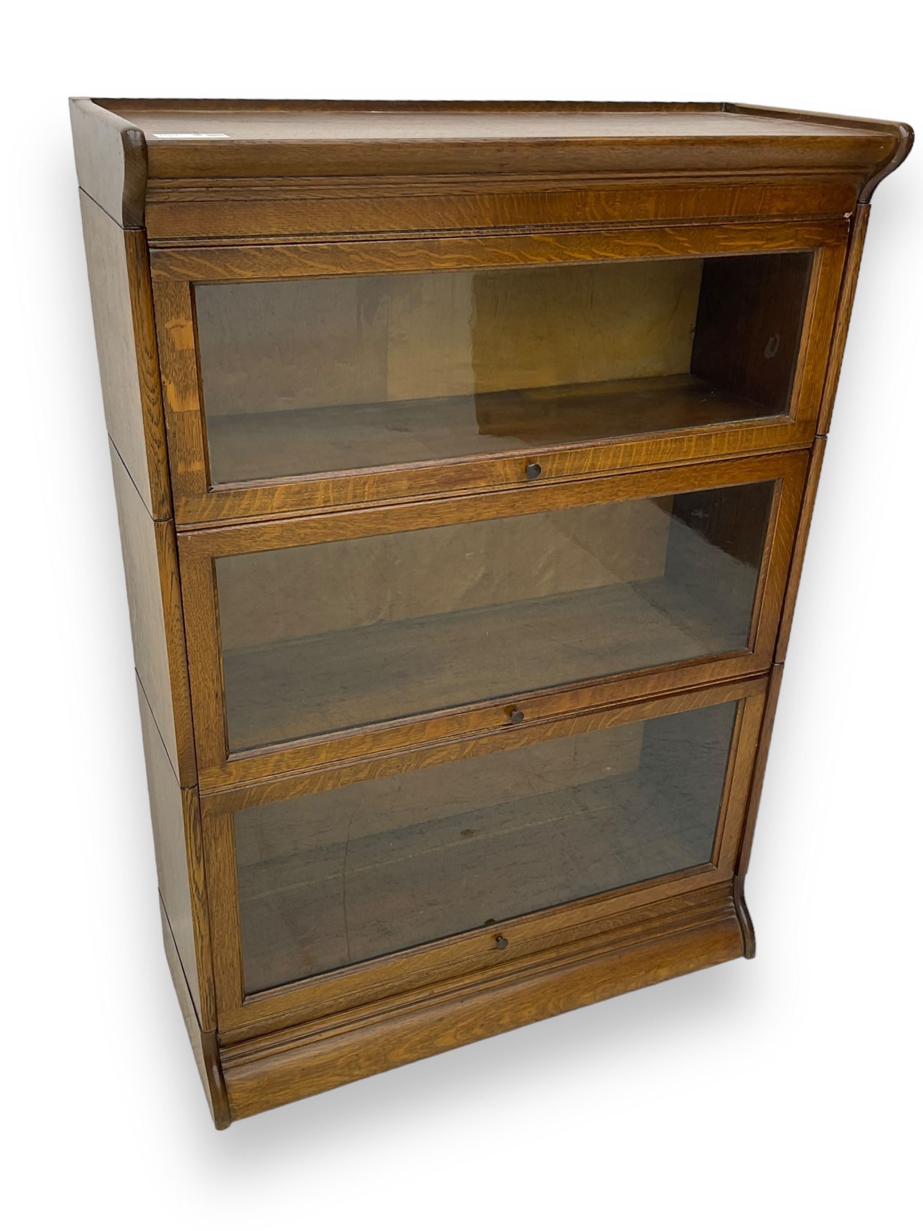 Early 20th century oak three-tier stacking library bookcase, enclosed by hinged and sliding glazed doors