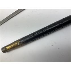 
Late 19th/early 20th century Anglo Indian ebony and bone sword stick with 62cm steel blade, brass locking ferrule and lion mask pommel L92 cm.