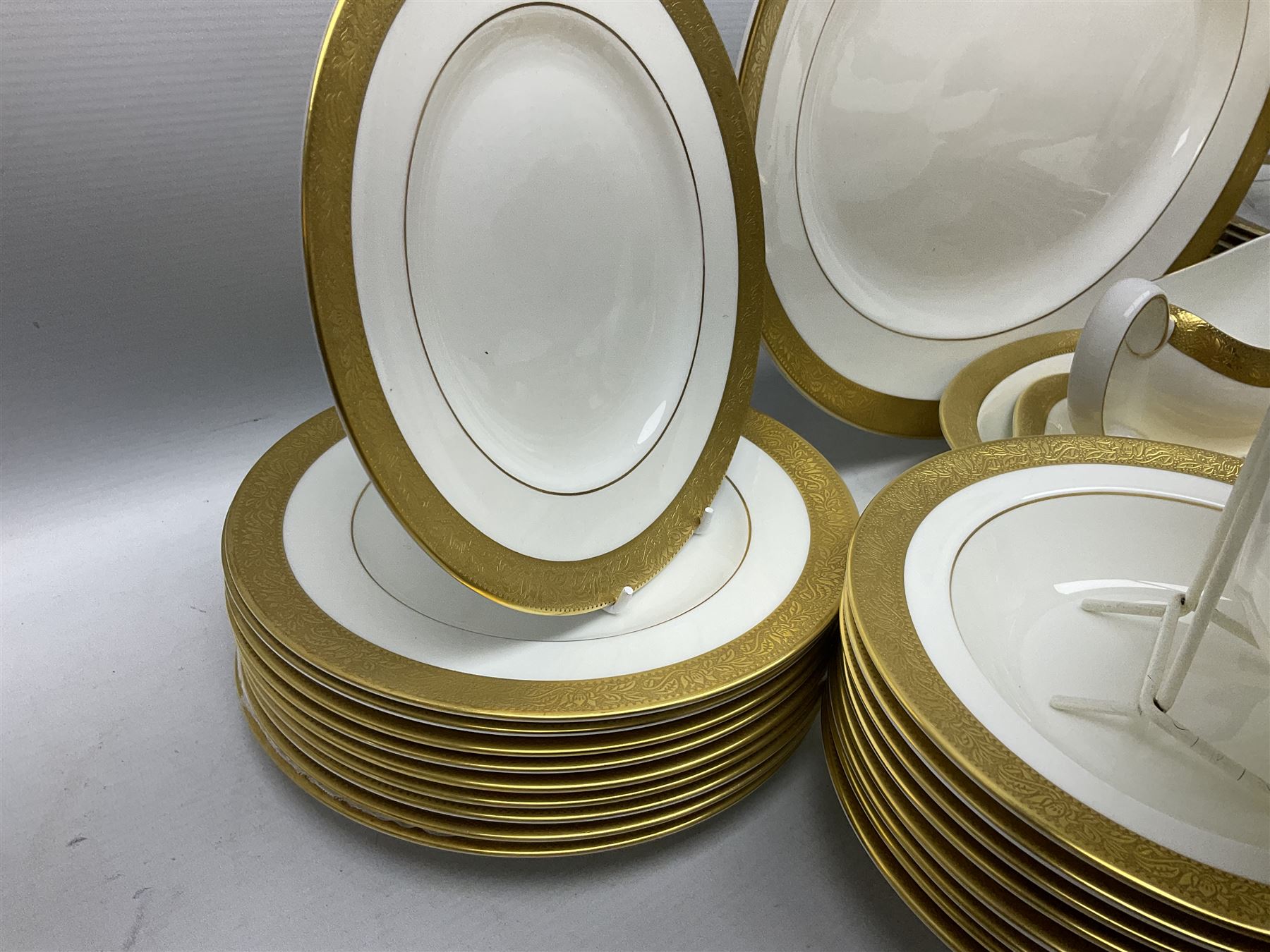 Wedgwood Ascot pattern part tea and dinner service, comprising eleven dinner plates, ten small dinner plates, nine bowls, eight dessert plates, seven saucers, nine tea cups, sauce boat and stand, milk jug, two twin handled soup bowls, serving dish and meat platter (60)