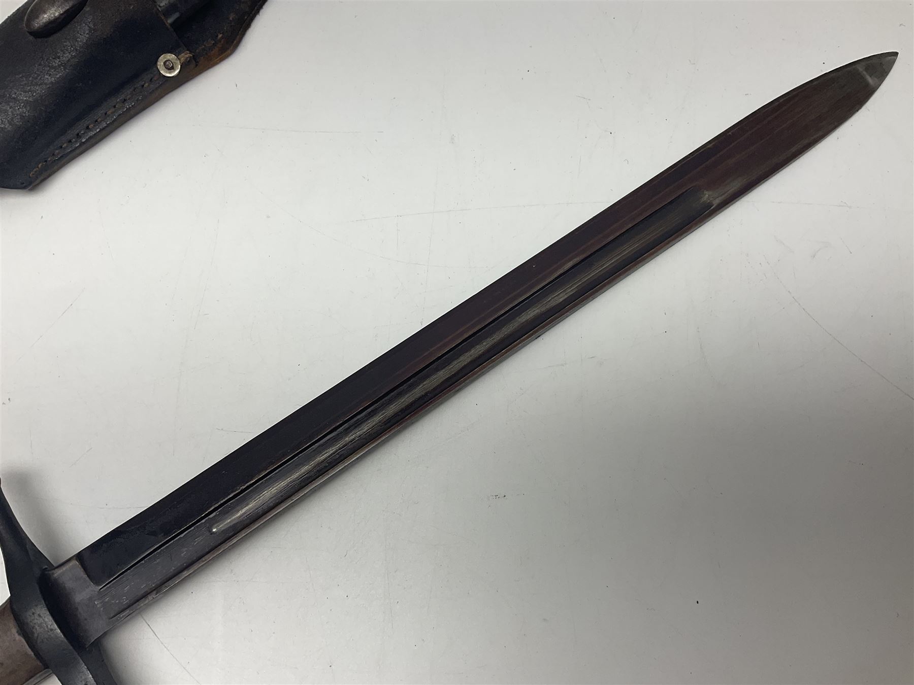 WW2 Italian Model 1891 bayonet with 30cm fullered blade; cross-piece marked PS 1941; in associated leather covered scabbard with frog L45cm overall