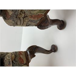 Matched pair early 20th century Queen Anne style wingback armchairs, walnut framed, sprung seats with seat cushions upholstered in needle work cover, shell carved cabriole front feet