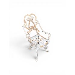 Pair of Victorian cast iron garden chairs, the ornate pierced back of scrolling foliate design, scrolling arm terminals over splayed supports formed of C and S-scrolls, in distressed white painted finish