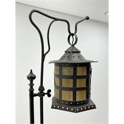 Late 20th century copper and wrought metal hanging lantern on stand, hexagonal copper lantern on adjustable stem, the main hand forged stem with pointed finial and twist decoration, three splayed shaped supports with spade shaped terminals