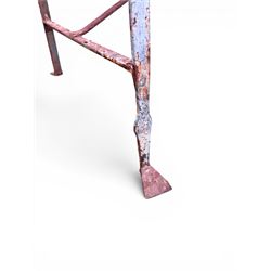 Regency period wrought iron strapwork garden bench, cresting rail with central Scottish thistle motif and flanking pediments, in distressed blue painted finish