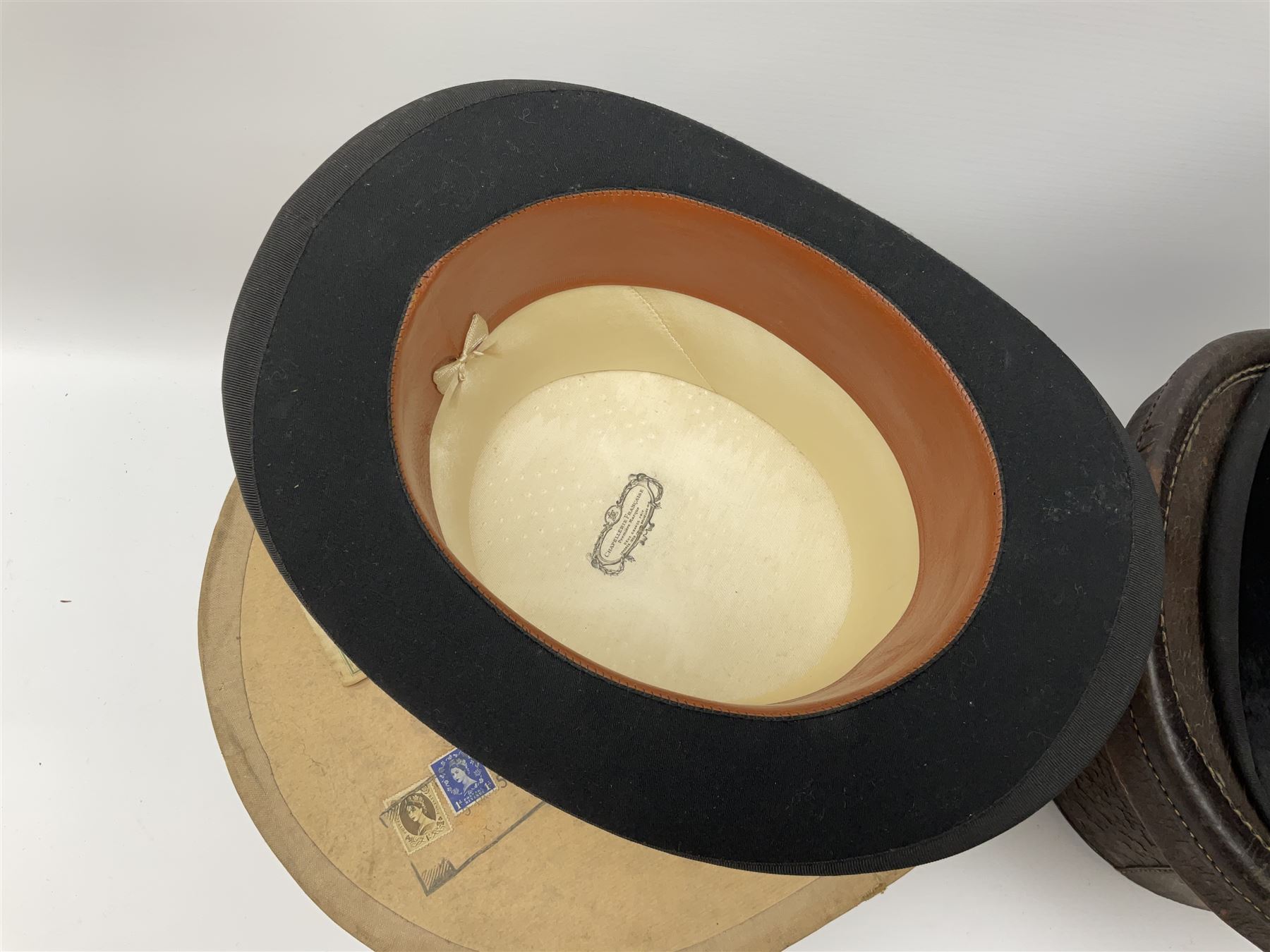 Top hat by Tress & Co London, in a  fitted leather leather case,  Top hat by Chapellerie Francaise. 