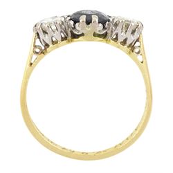 18ct gold sapphire and diamond three stone ring, single oval cut sapphire, with two round brilliant cut diamonds set either side, Sheffield 1987, total diamond weight approx 0.60 carat