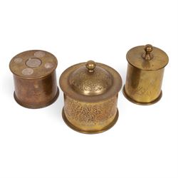 Three WWI trench art tobacco jars including an example with the lid embedded with silver r...