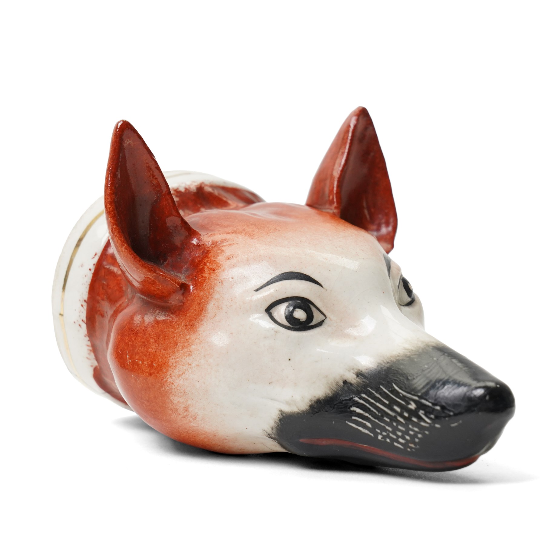 19th century Staffordshire fox head stirrup cup H12cm and a pastille burner in the form of a two storey cottage (2)