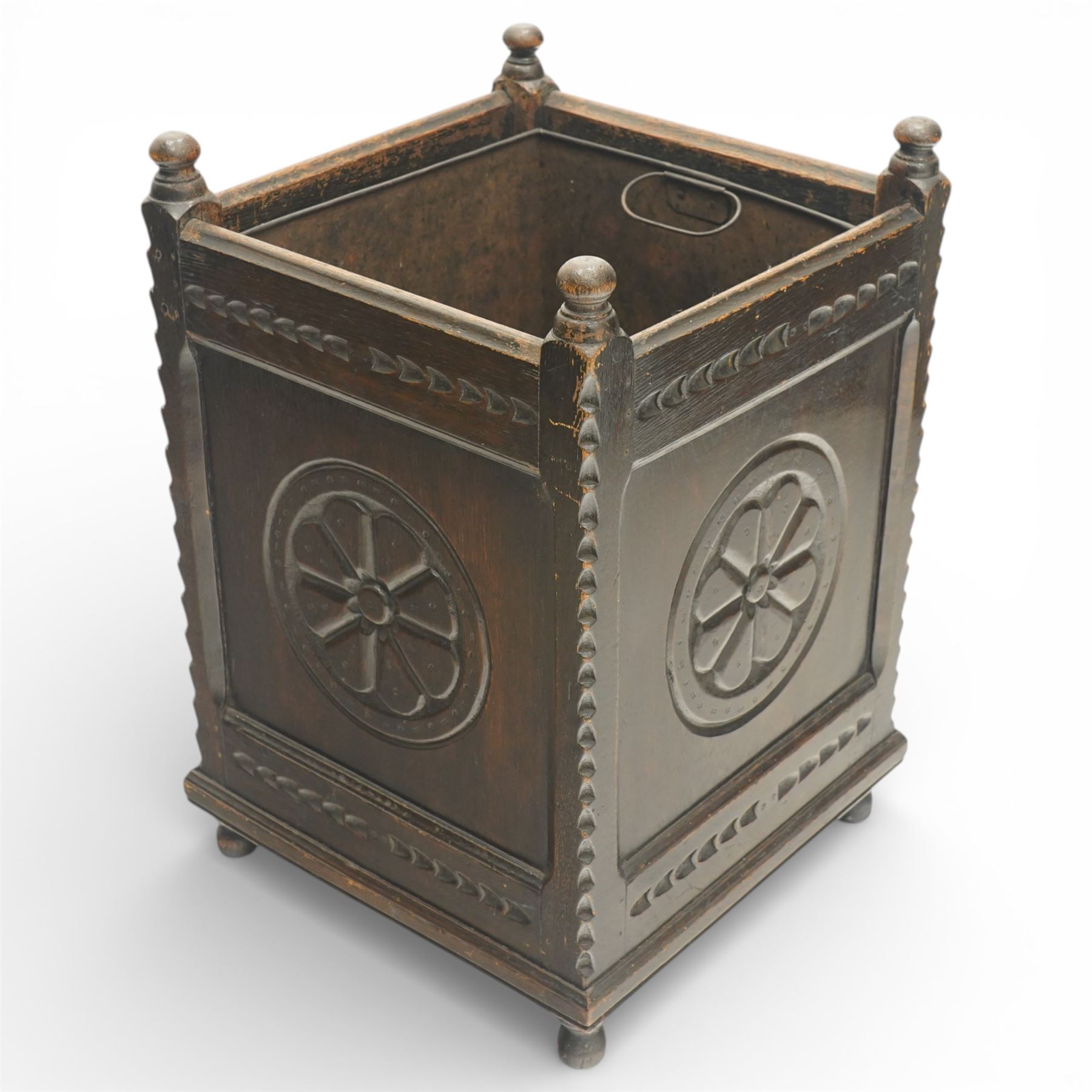 20th century carved fireside accessories; a carved coal bucket with metal liner and a carved fire screen