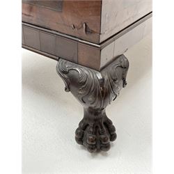 19th century camphor wood and mahogany silver chest, the hinged banded top with circular brass mounts which secure the interior strap hinges, fretwork metal strapping to the corners, on stand with plain frieze and acanthus carved cabriole ball and claw feet