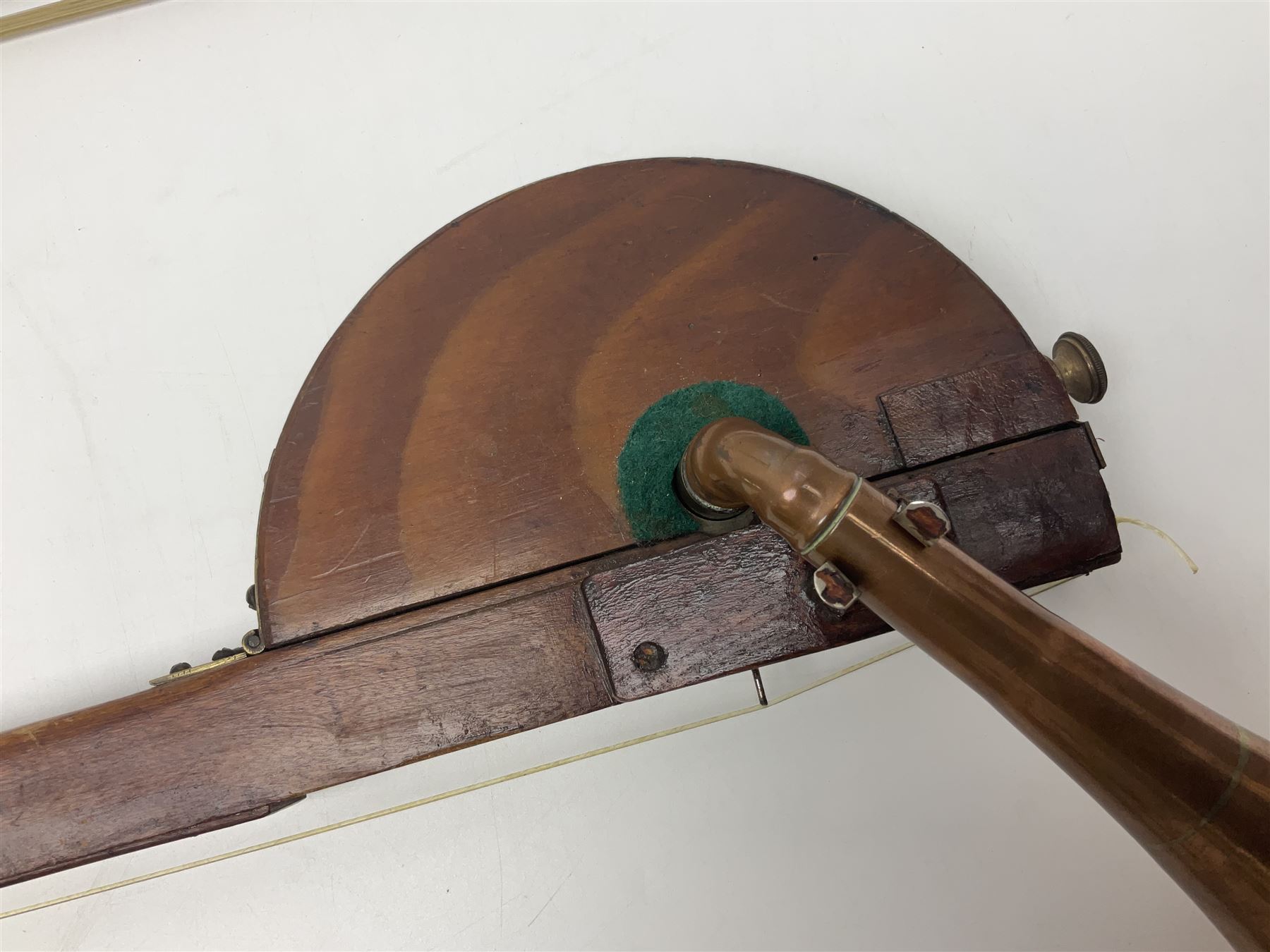 Fruitwood and elm single string phono fiddle with long neck and copper horn L76cm; and a violin bow (2)