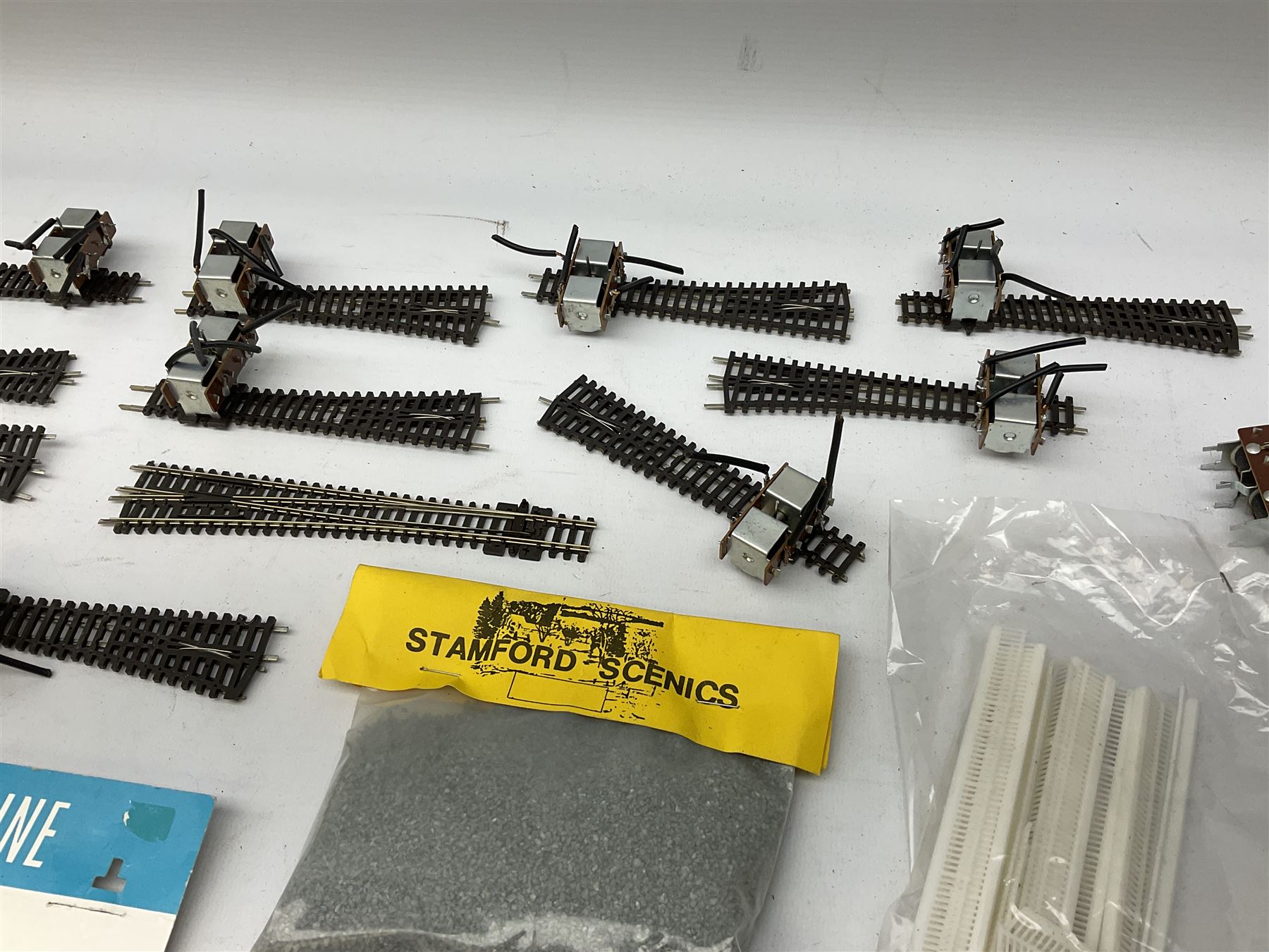 Peco 'N' gauge - quantity of track including motorised points, straights, curves etc; and quantity of packeted accessories including Motor(Switch Machines), nickel silver joiners etc