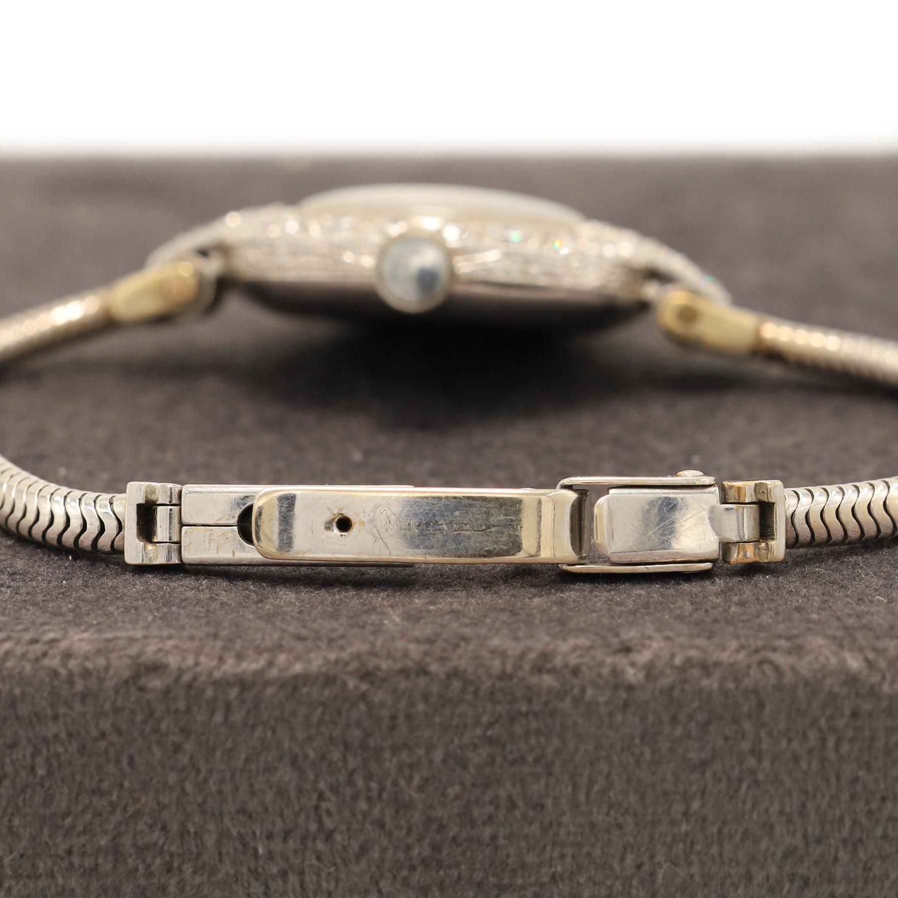 Vertex Supreme ladies platinum and 9ct white gold diamond manual wind wristwatch, silvered / white dial with Arabic hour markers, the bezel set with thirty-two round brilliant cut diamonds, stamped Platinum, on a white gold snake bracelet, Birmingham 1967, total diamond weight approx 1.60 carat