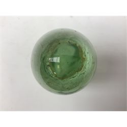 Victorian green glass dump paperweight with flower inclusions