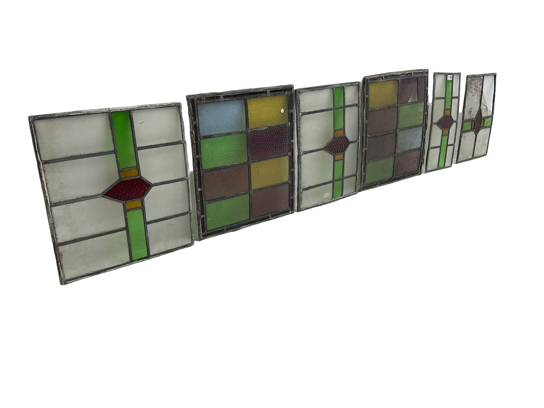 Six leaded stained glass window panes, largest measuring 46cm x 41cm