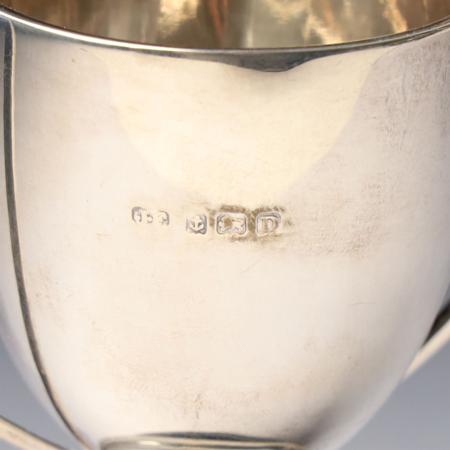 Victorian silver cup with embossed decoration on a plastic base, height of cup 16cm Birmingham 1868 and a small silver challenge cup 'Whitby Show 1950'