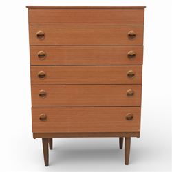 Mid 20th century teak dressing chest, rectangular top hinged to reveal a fitted interior with divisions and a rectangular mirror to the underside, over five long drawers with recessed circular handles, raised on tapering supports