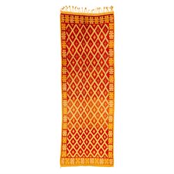 Moroccan Berber hand knotted runner, the red and orange ground woven with an all over latt...