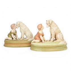 Two Royal Dux figures, each modelled as a toddler and dog, upon oval base, one titled 'Can...