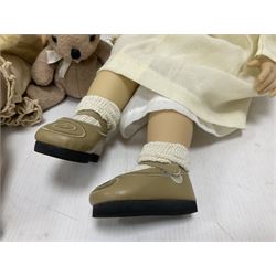 Two Zapf Creation limited edition designer collection dolls, by Brigette Paetsch, the first example with faux suede jacket, red jumper and denim skirt, no. 460, the second example 'Linda' in white dress with teddy bear accessory, no. 785, each signed B Paetsch, tallest L60cm