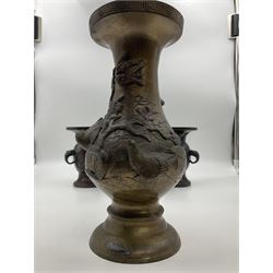 Chinese bronze vase, of baluster form with elongated neck, decorated in relief with birds amongst prunus blossom, together with a smaller pair of twin handled bronzed vases, decorated with peacocks and a blue Peking glass dish, with white metal mounted decorated with dragons, bronze vase H23.3cm