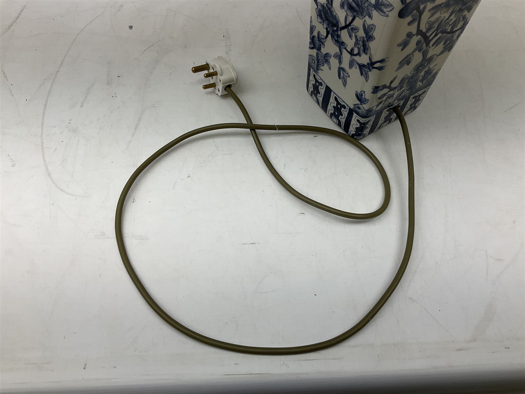 India Jane table lamp, decorated with blue birds and floral vines upon a white ground, fitted with a cream lampshade, H62cm 