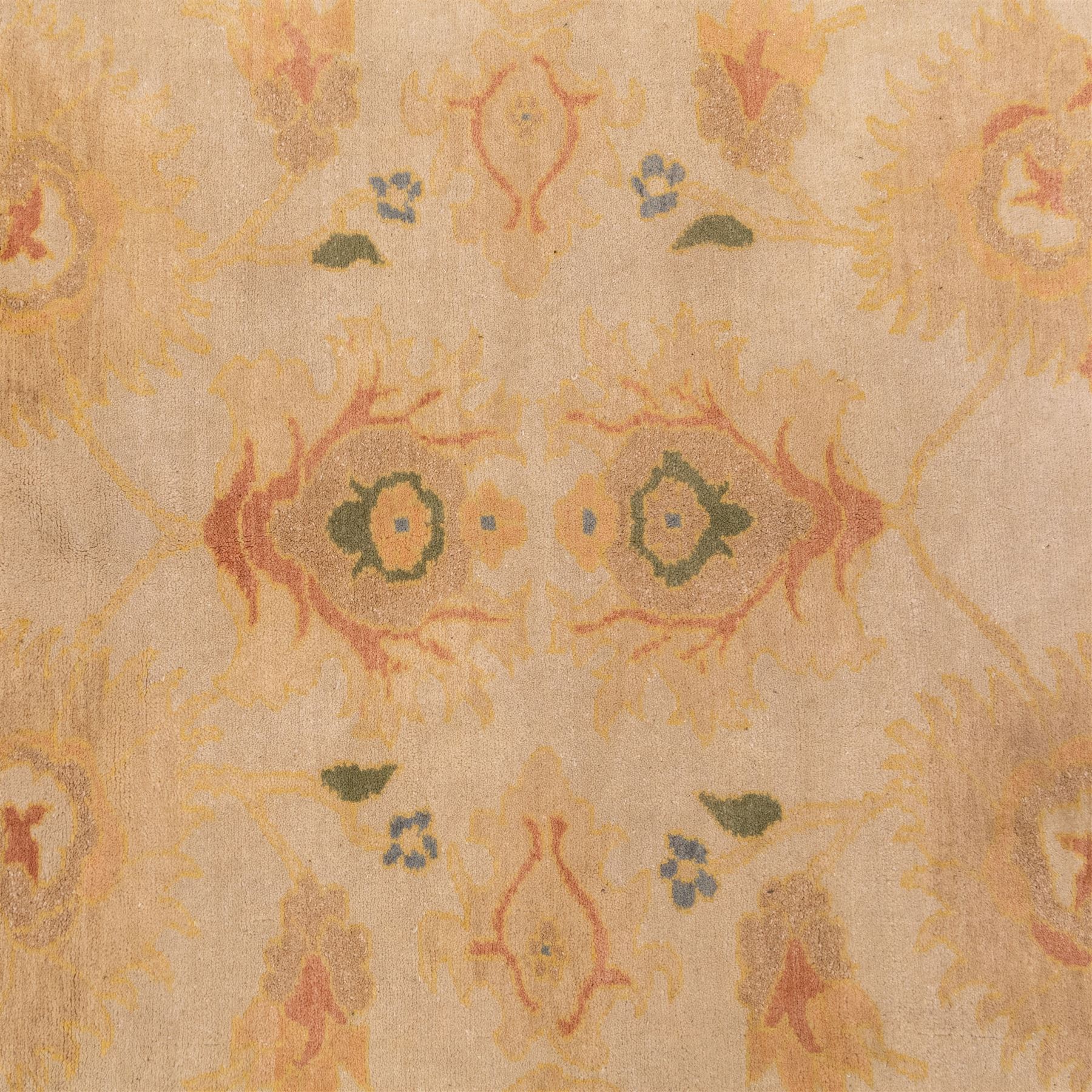 West Persian hand-knotted Ziegler design rug, ivory field decorated with an all-over lattice of stylized palmettes and floral sprays linked by angular vines, border of scrolling floral ornamentation in a palette of blush pink, sage green, powder blue, and soft ochre, with cotton fringe ends 