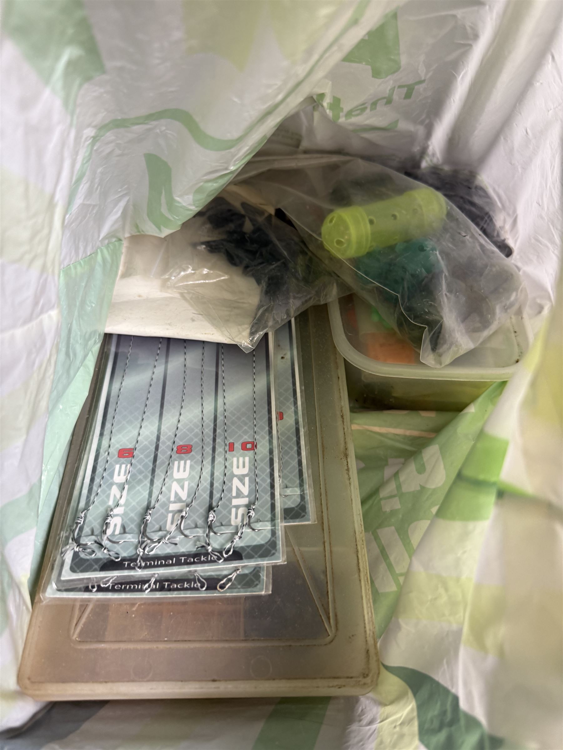 Fishing equipment, including two Fladen Vantage reels, split cane rod, hooks, line, lures etc, in Leeda plastic box and table top plastic drawers