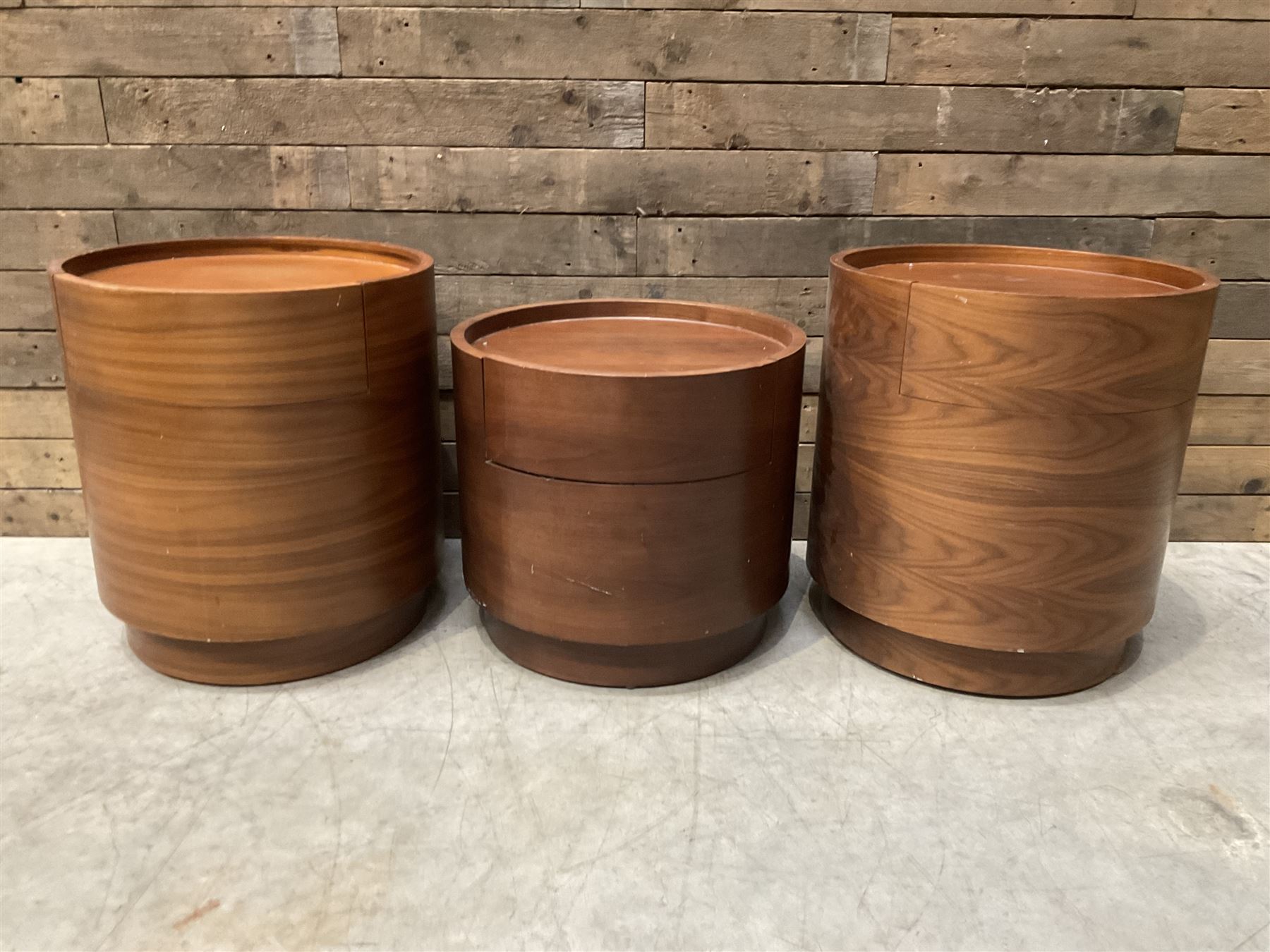 Three walnut circular barrel shaped lamp tables, fitted with single drawer (lower table D53cm, H49cm)