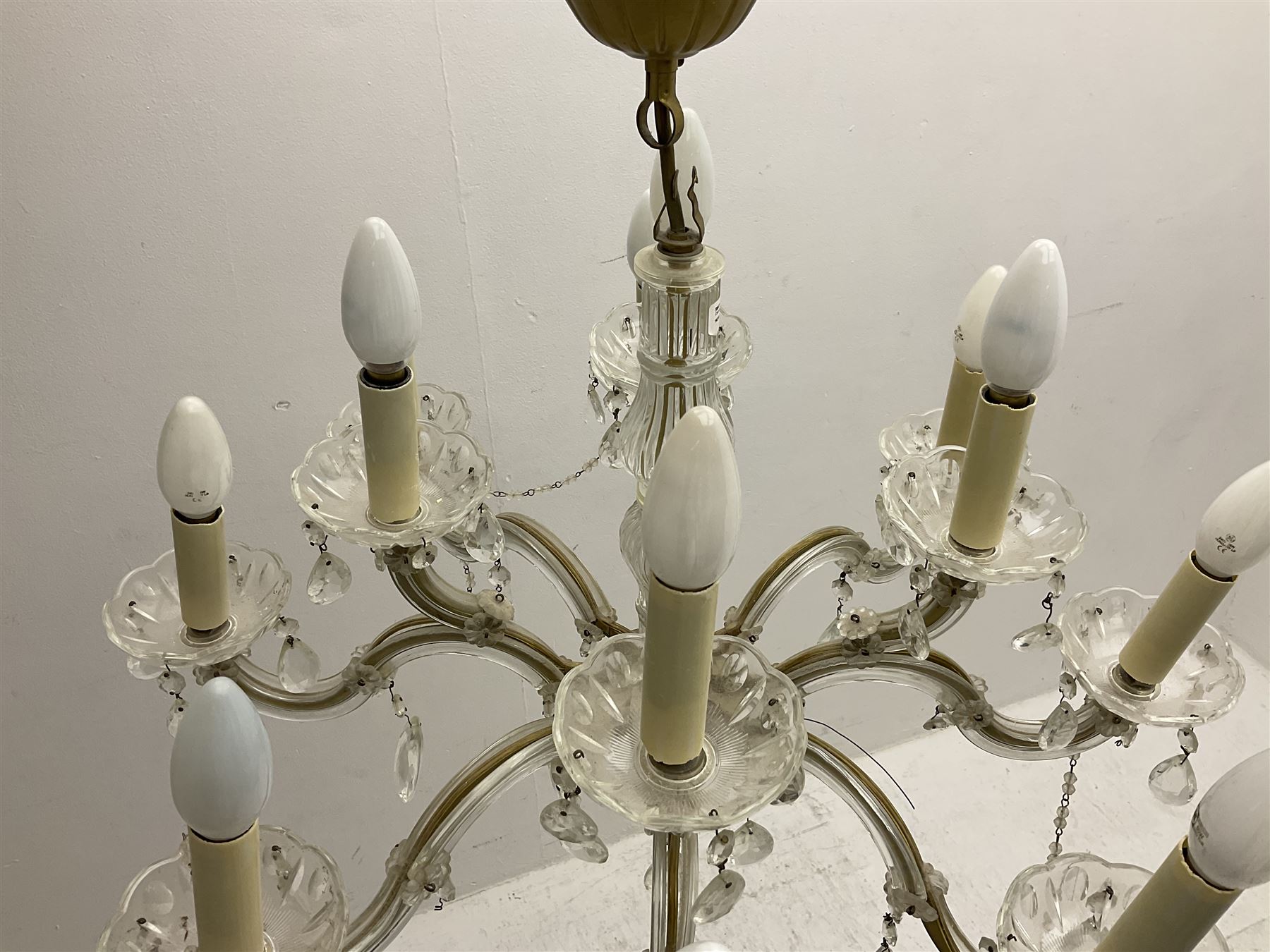 Victorian style glass eight branch chandelier, with drip trays, brass tone support, and drops