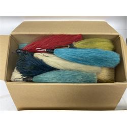 Quantity of military horse hair plumes and feather hackles, cloth stripes and regimental titles etc